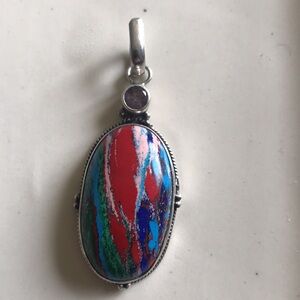 Sterling and multicolored stone (fordite?)pendant